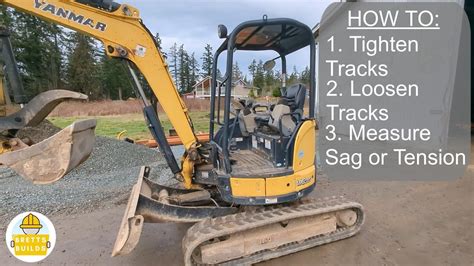 how to get a track back on a mini excavator|mini excavator track release.